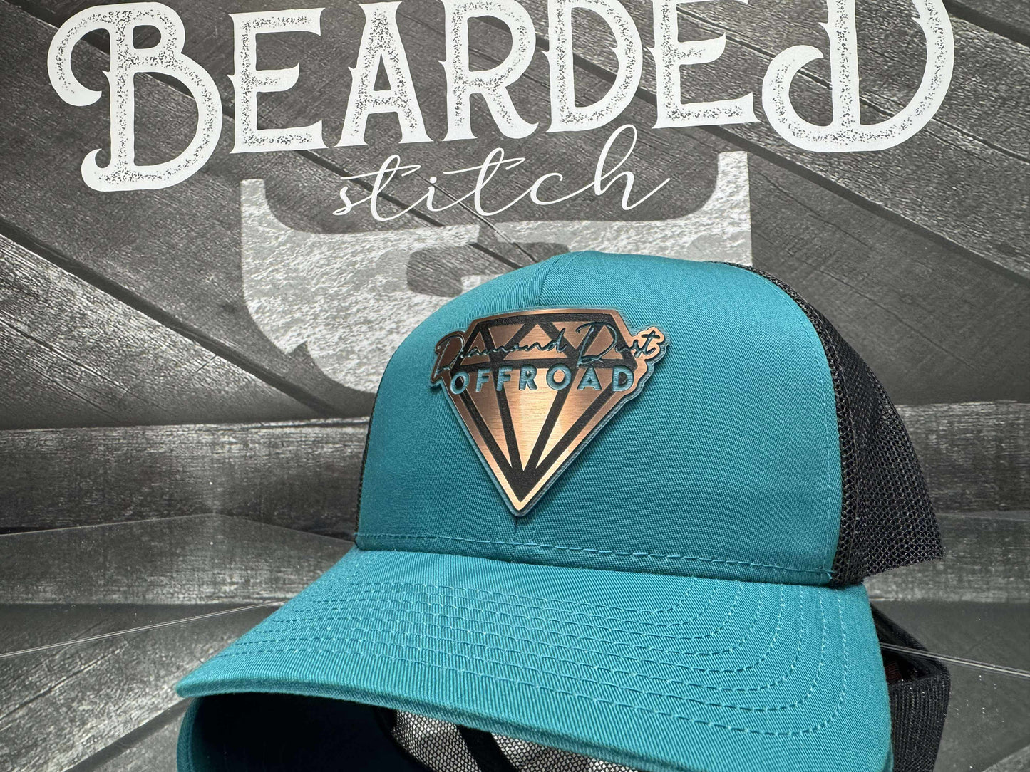 Teal snapback with black mesh - teal/stainless logo