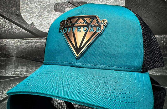 Teal snapback with black mesh - teal/stainless logo